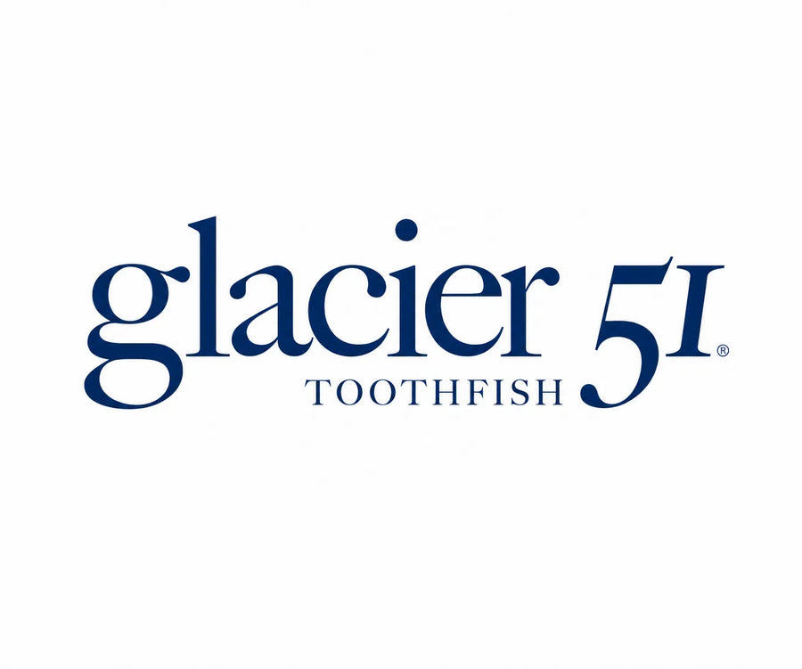 Album cover art for 'Toothfish' by Glacier 51, featuring white stylized text over a close-up photograph of cracked blue-gray ice.